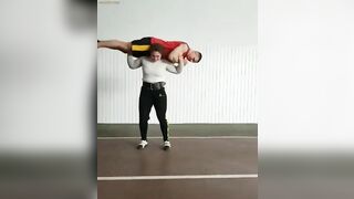strong women lift guy overhead