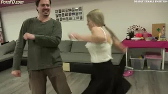 Beautif blonde Karateka kicks man