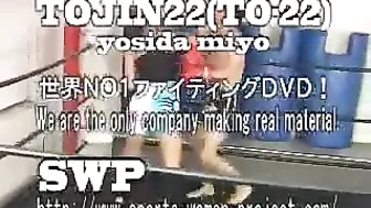 Asian girl boxes and kicks male opponent