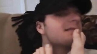 Rubbing smelly white socks into his face
